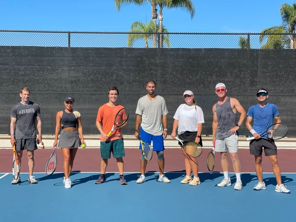 Seven LBTA players in a lineup on an outdoor court — community and belonging